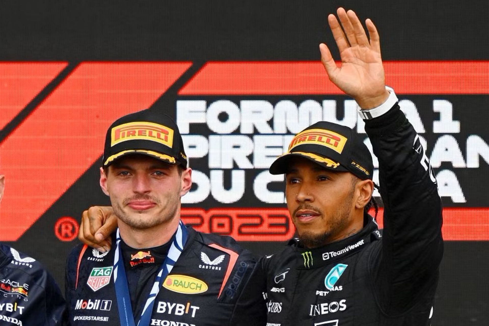 Max Verstappen and Lewis Hamilton celebrate on the podium during the 2023 F1 Canadian Grand Prix. (Photo by Clive Mason/Getty Images)