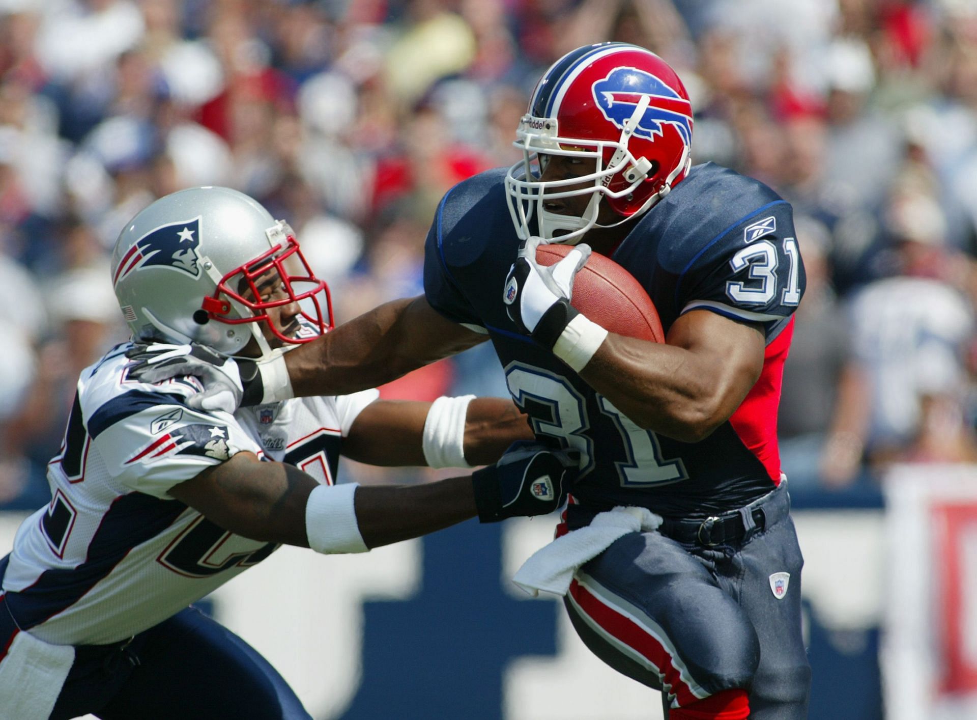 Asante Samuel tries to tackle Sammy Morris