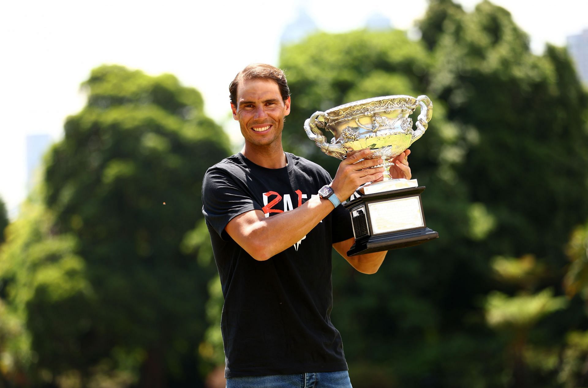 Rafael Nadal holds the 2022 Men&#039;s Australian Open trophy.