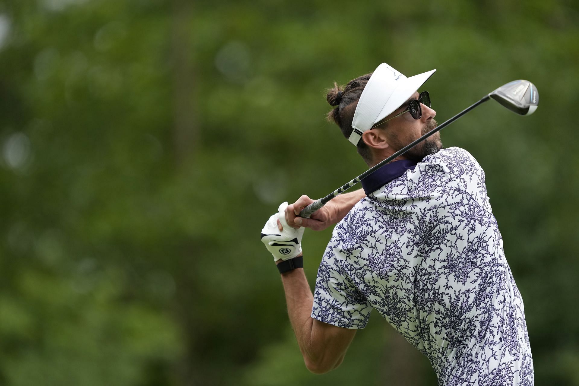 Former Olympic Swimmer Michael Phelps of the United States plays his tee shot during the Celebrity Foursome in the second round of the American Family Insurance Championship