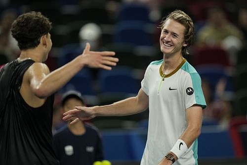 Ben Shelton and Sebastian Korda exchange handshakes at the net