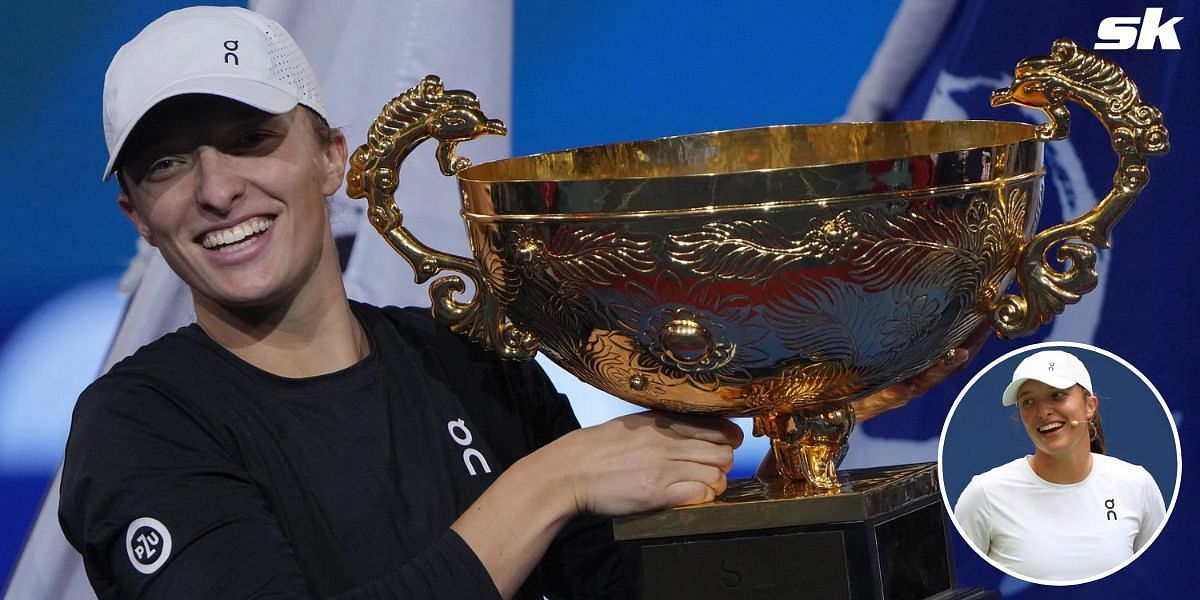 Iga Swiatek lifts the China Open trophy.