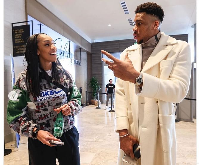 Giannis Antetokounmpo shows off his $6,100 Breitling watch while congratulating WNBA Finals MVP A'Ja Wilson
