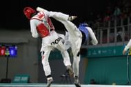 Bernardo Pie of Republica Dominicana (Red) fights against Khalfani Harris of United States (Blue) in Men's Kyorugi - 68kg finals at the 2023 Pan Am Games in Santiago, Chile.