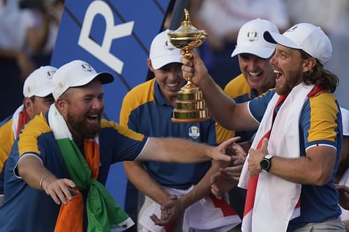 Tommy Fleetwood lifts the Ryder Cup after Europe won the trophy (Image via Getty)