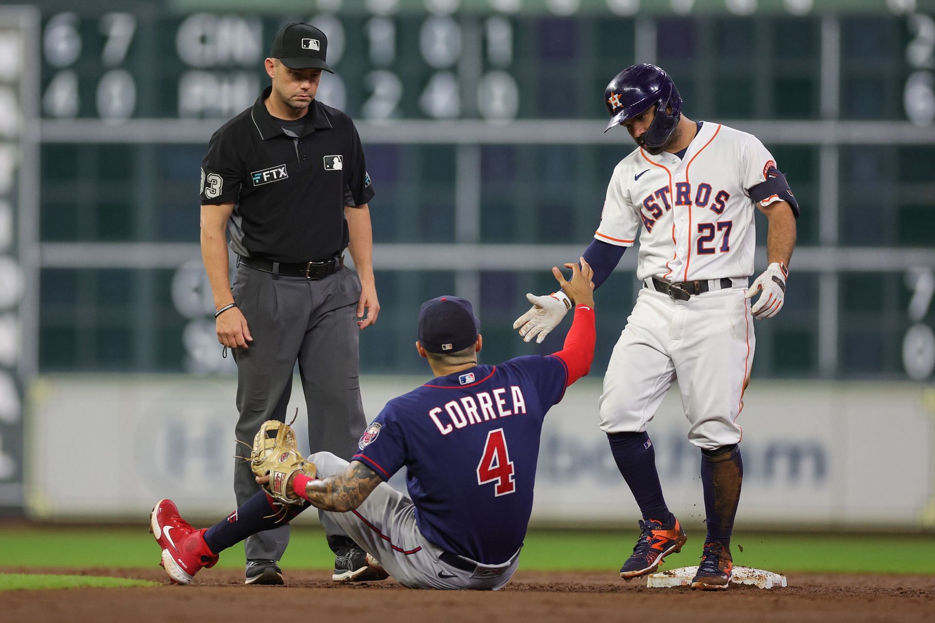 Jose Altuve helps his friend and former teammate to his feet