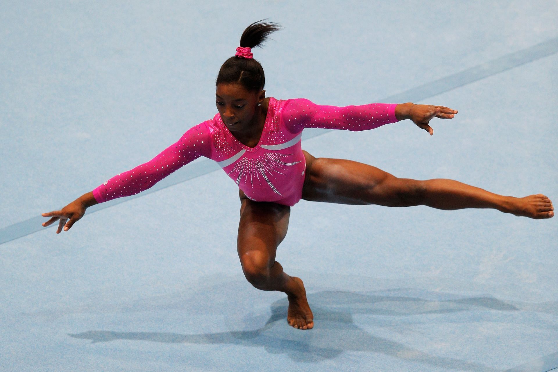 Simone Biles competes in the floor exercise during the 2013 Artistic Gymnastics World Championships in Antwerp, Belgium