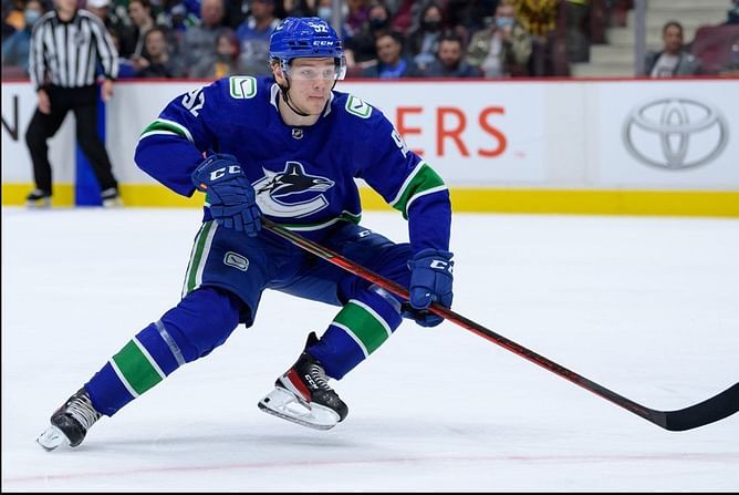 Watch: Vasili Podkolzin stretchered off ice after hit from Keaton Middleton