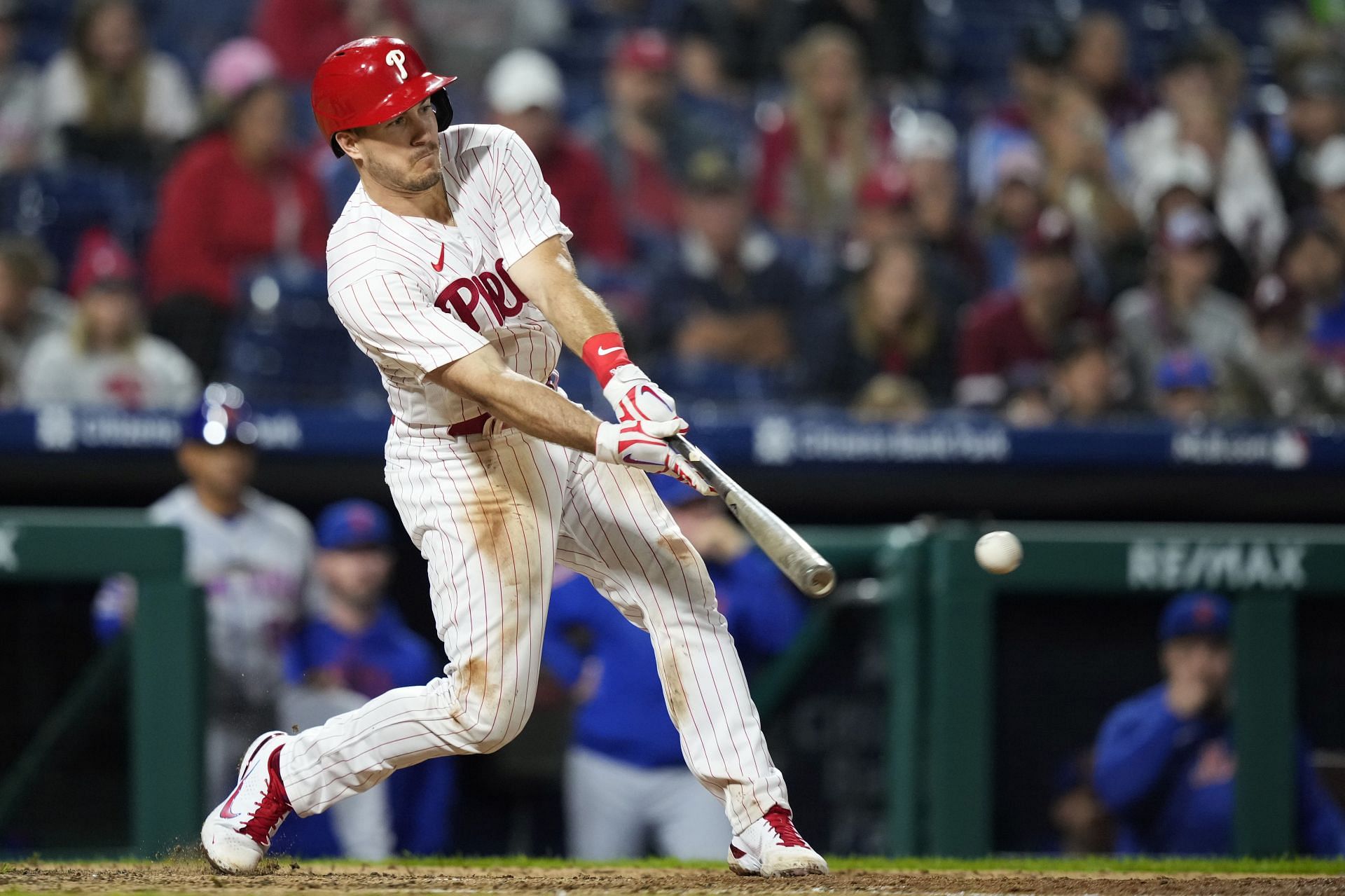 Philadelphia Phillies - Photo of J.T. Realmuto on the field with three 2022  season awards in front of him. From left to right, Realmuto received the  Silver Slugger award, All-MLB First Team