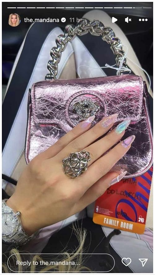 Pat Beverley's partner, Mandana Bolourchi, flashes her accessories