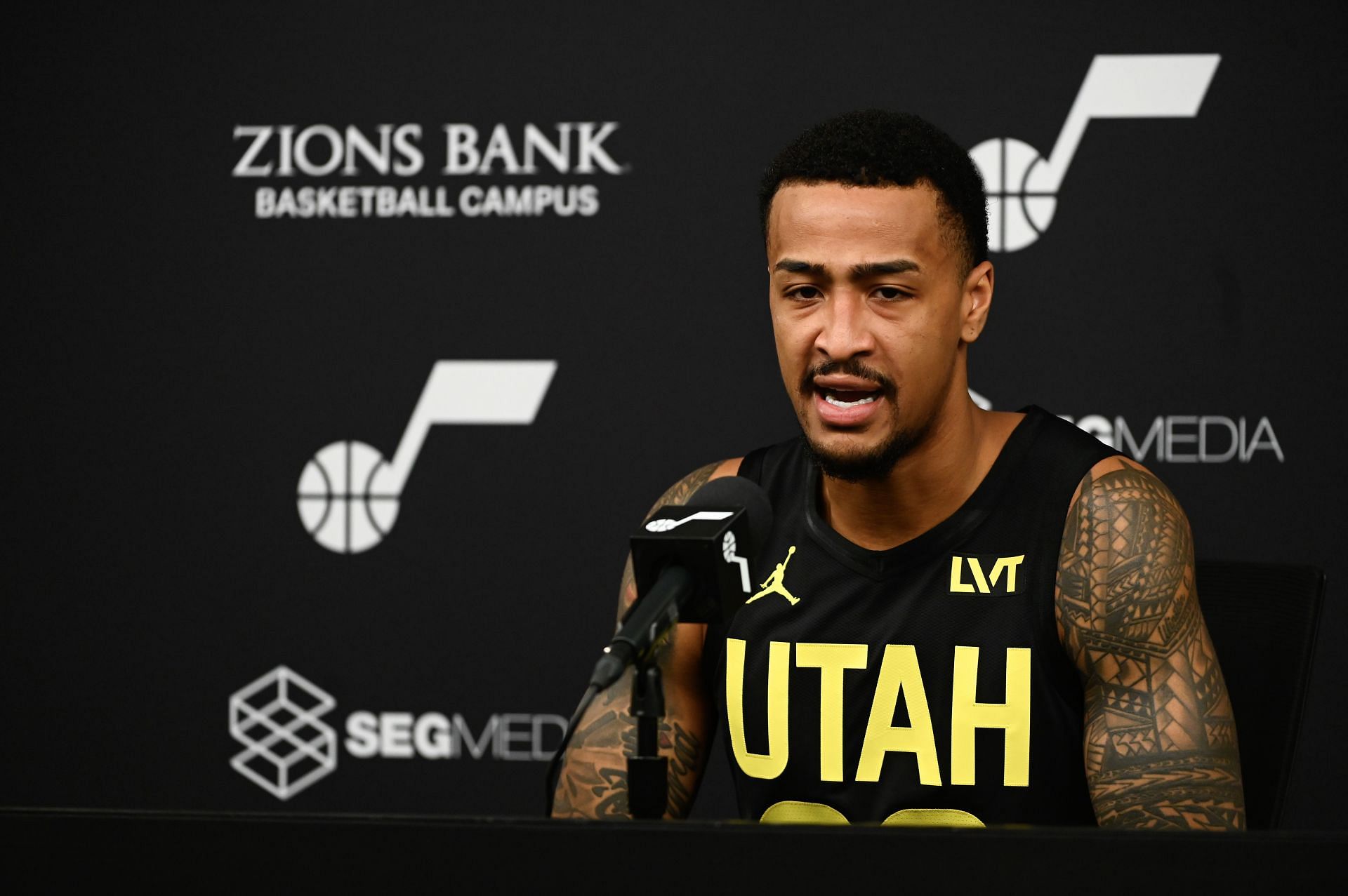 John Collins speaks with reporters during the Utah Jazz&#039;s Media Day
