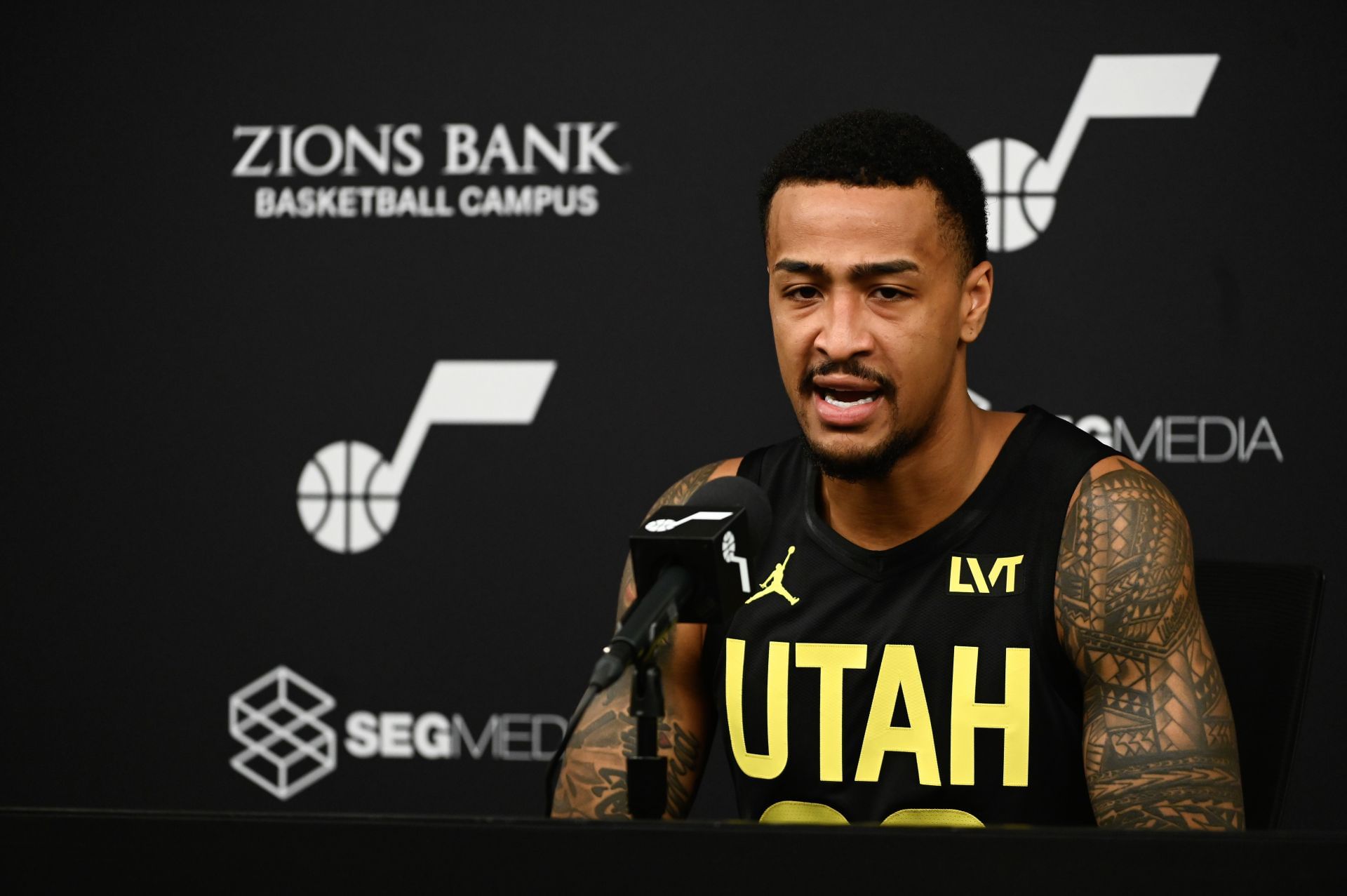 John Collins speaks with reporters during the Utah Jazz's Media Day