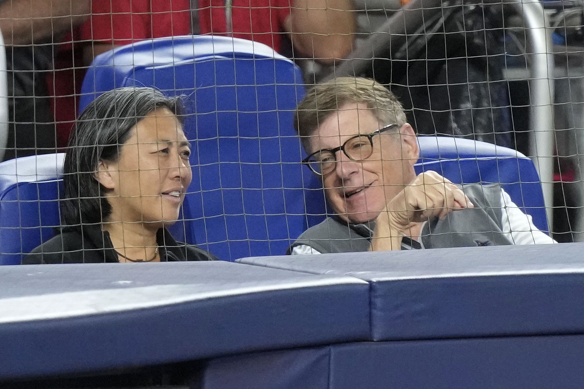 Miami Marlins chairman Bruce Sherman chats with Kim Ng during a game against the Cincinnati Reds