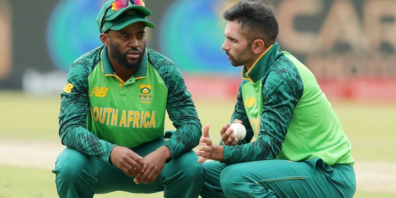 Keshav Maharaj (right) in conversation with captain Temba Bavuma.