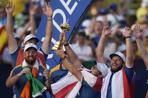 Europe's Rory McIlroy lifts the Ryder Cup after Europe won the trophy defeating the United States at the Marco Simone Golf Club