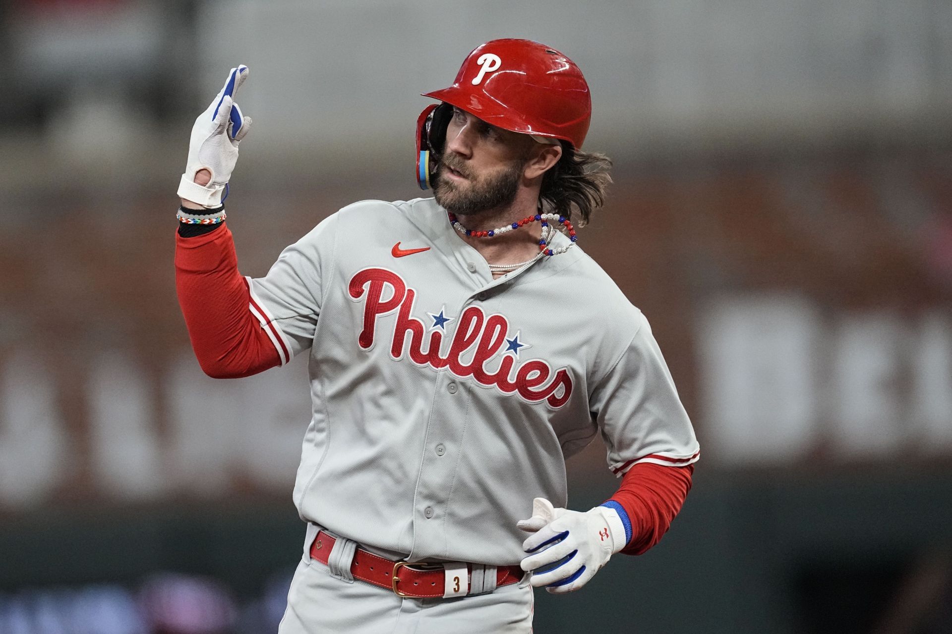 Philadelphia designated hitter Bryce Harper celebrates hitting a solo homer against the Atlanta Braves