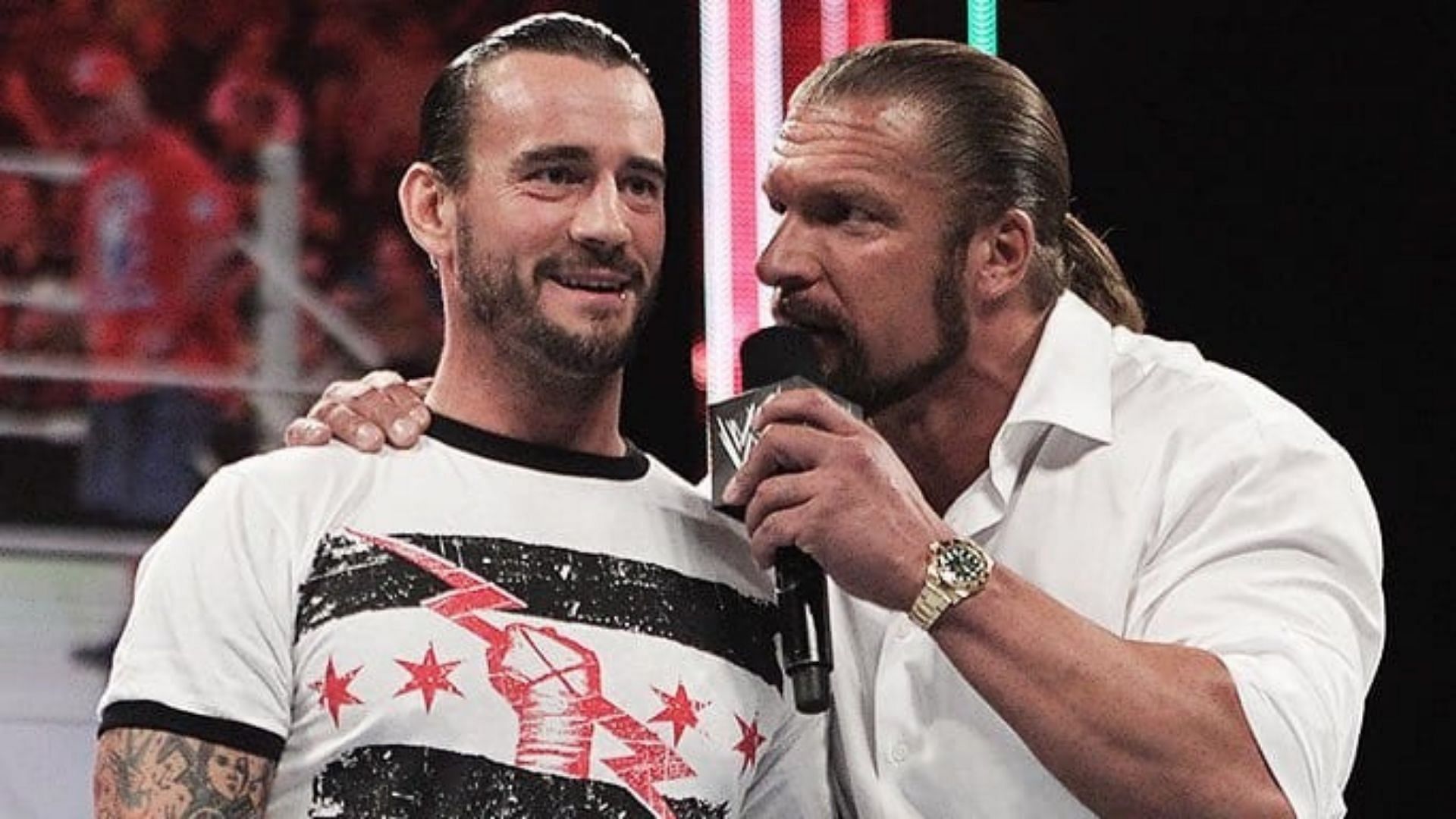 CM Punk(left); Triple H(right)