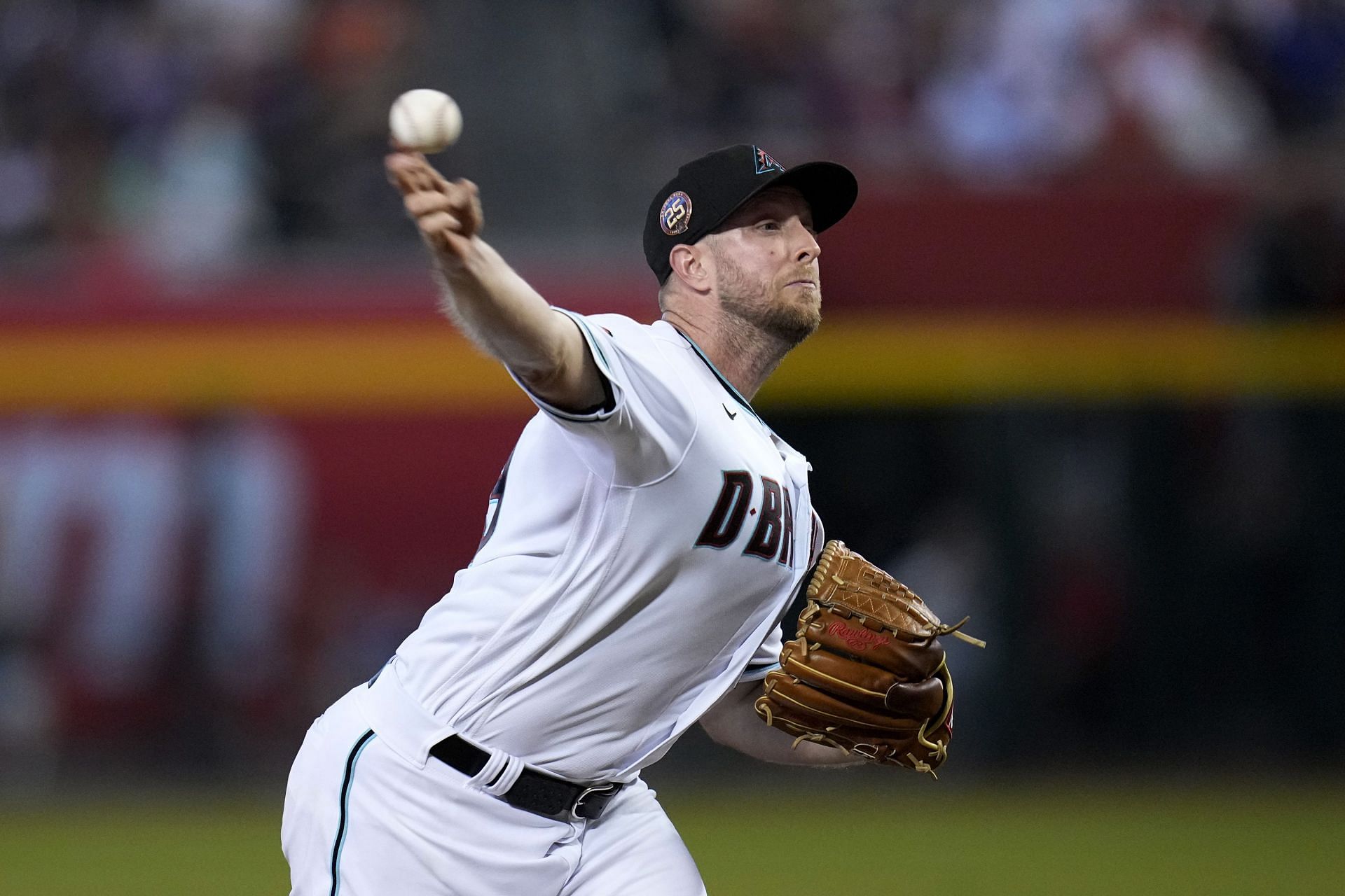 Arizona Diamondbacks starting pitcher Merrill Kelly throws against the Houston Astros during a game in Phoenix