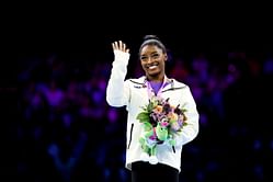 Katelyn Ohashi reacts to Simone Biles' emotional podium photograph at World Artistic Gymnastics Championships