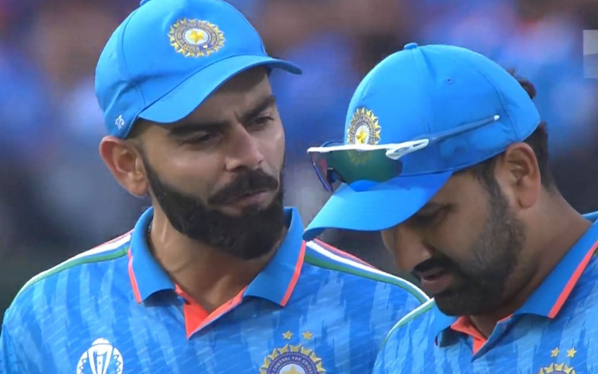 Virat Kohli and Rohit Sharma chatting during the first innings on Sunday. 