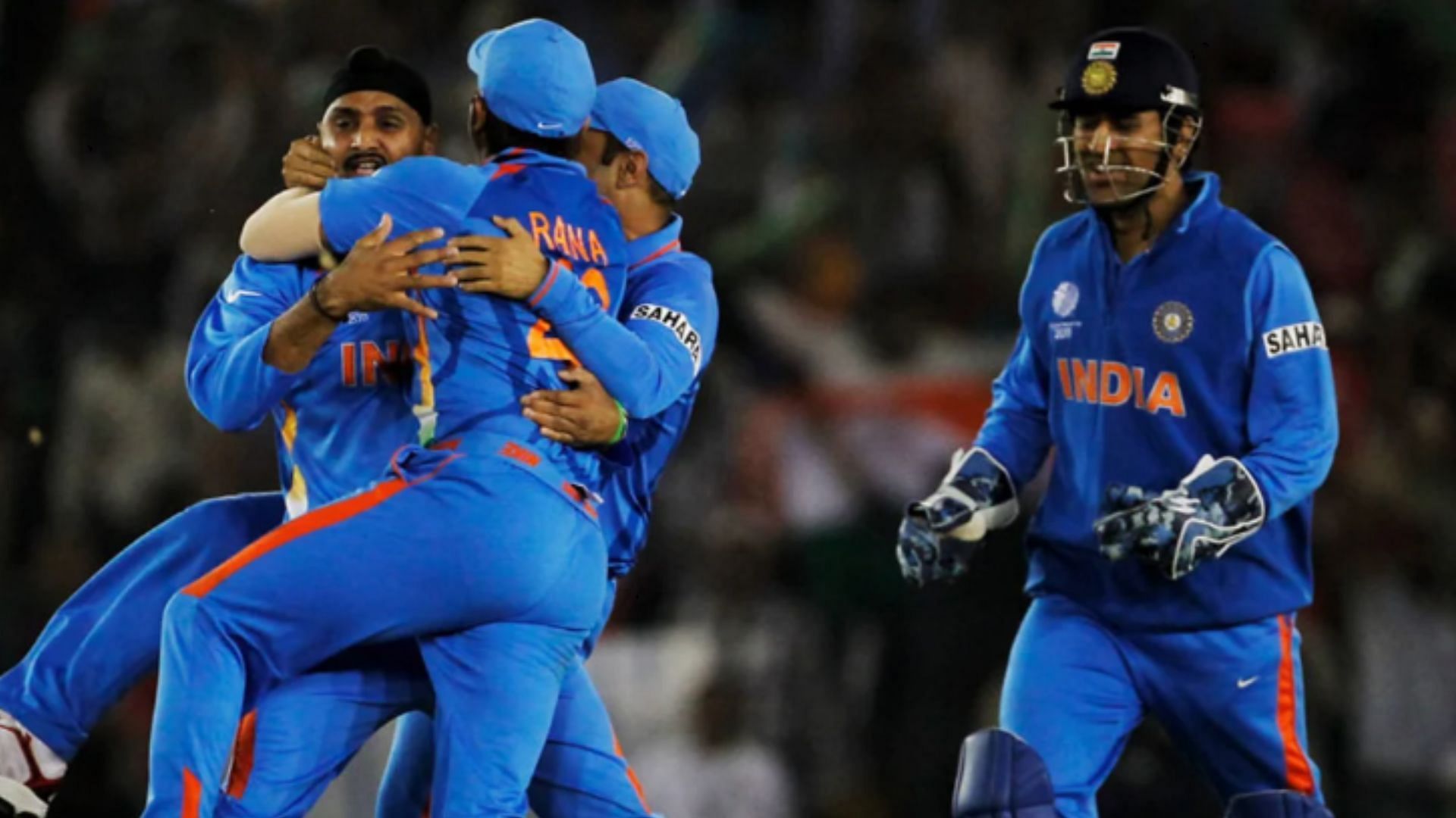 Harbhajan celebrates with his teammates after bagging the wicket of Umar Akmal (Pic: Getty)