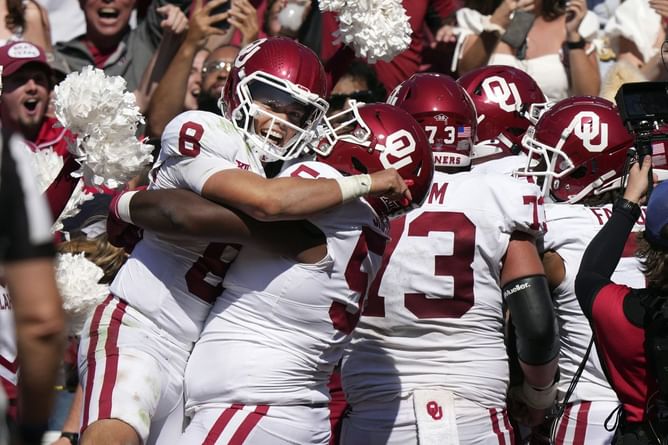 Two Oklahoma football players celebrate Red River showdown with matching tattoos after a 34-30 victory against Texas Longhorns