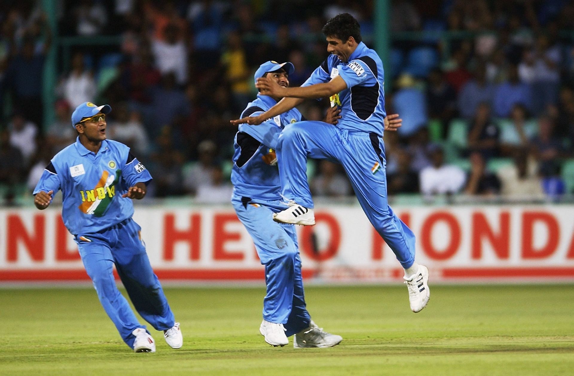 Ashish Nehra of India celebrates the wicket of Craig White of England
