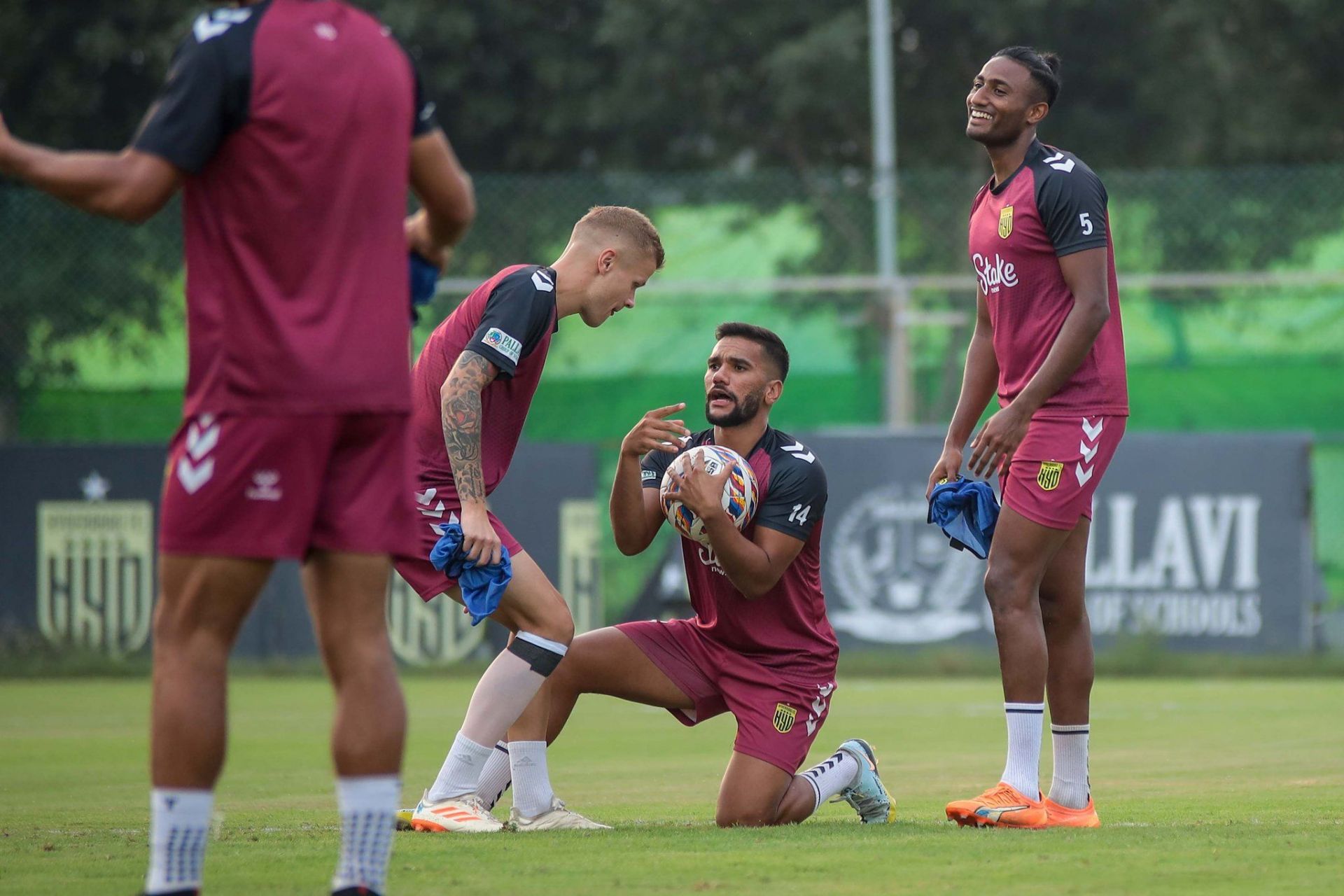 Sahil Tavora (holding the ball) joking around with Petteri Pennanen and Vignesh Dakshinamurthy in training.