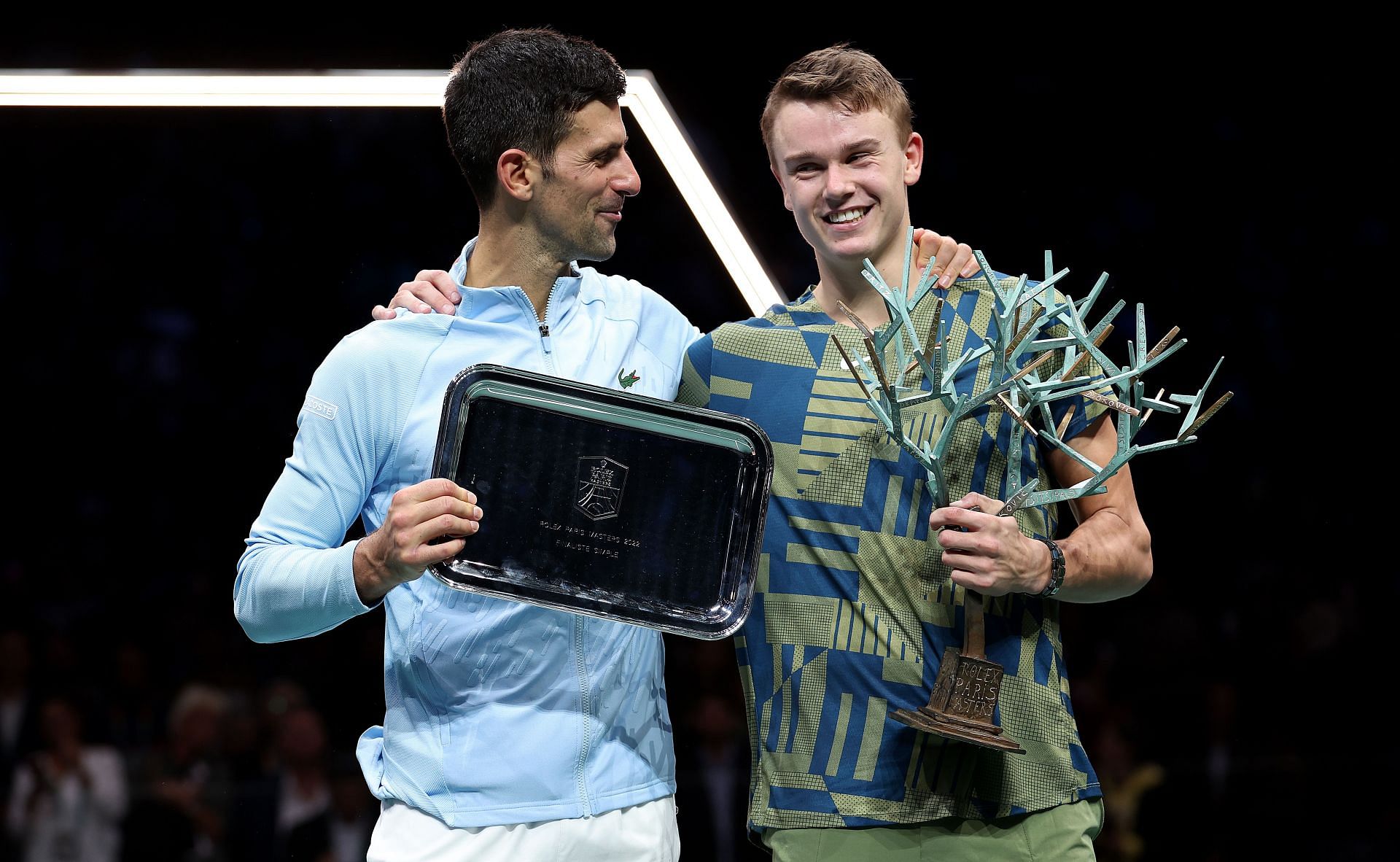 Novak Djokovic and Holger Rune pictured with their Paris Masters trophies