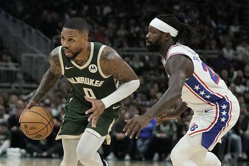 Damian Lillard (left) of the Milwaukee Bucks against Patrick Beverley of the Philadelphia 76ers