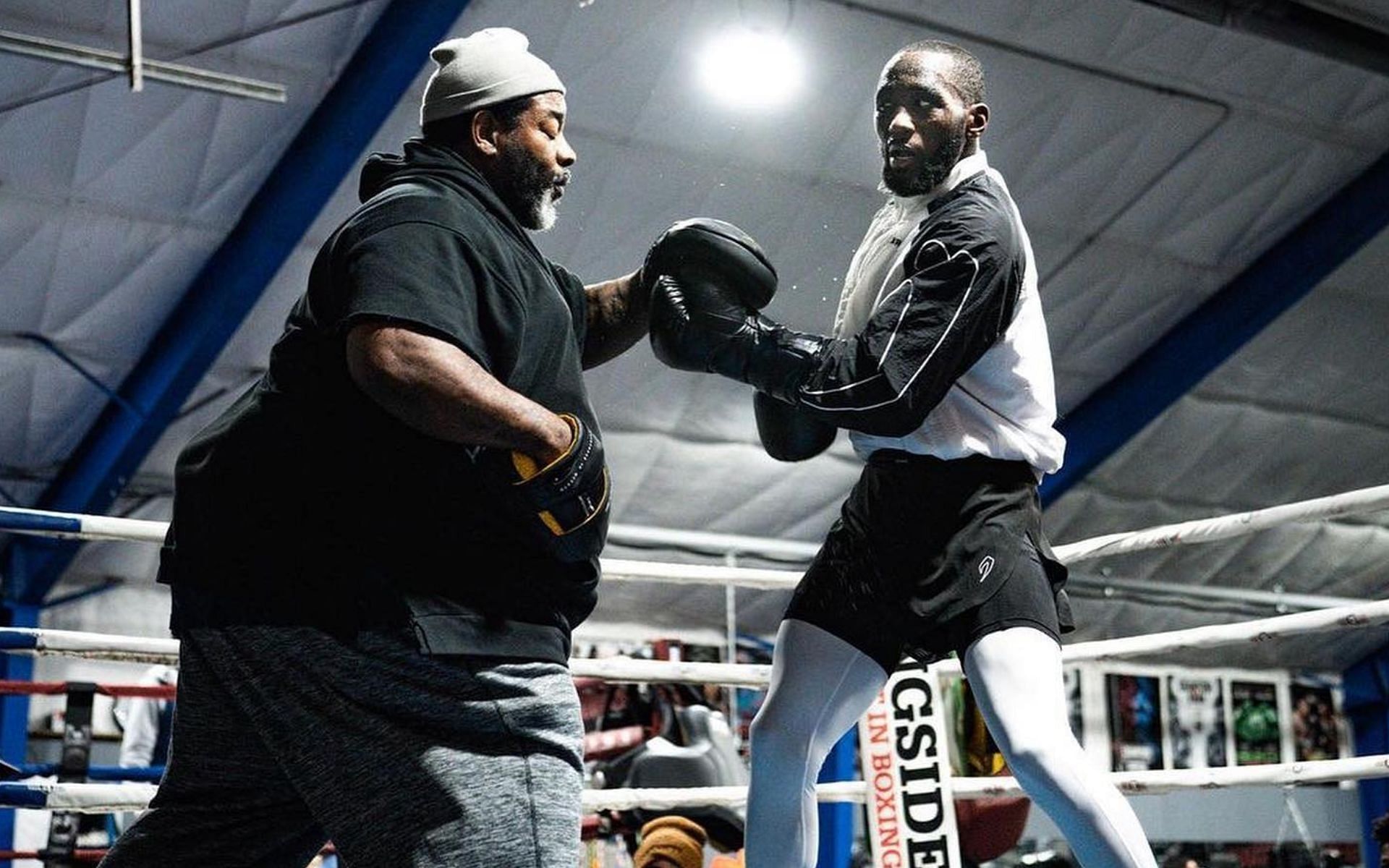 Terence Crawford and trainer Brian McIntyre [Images via: @BatmanBoxing on X]