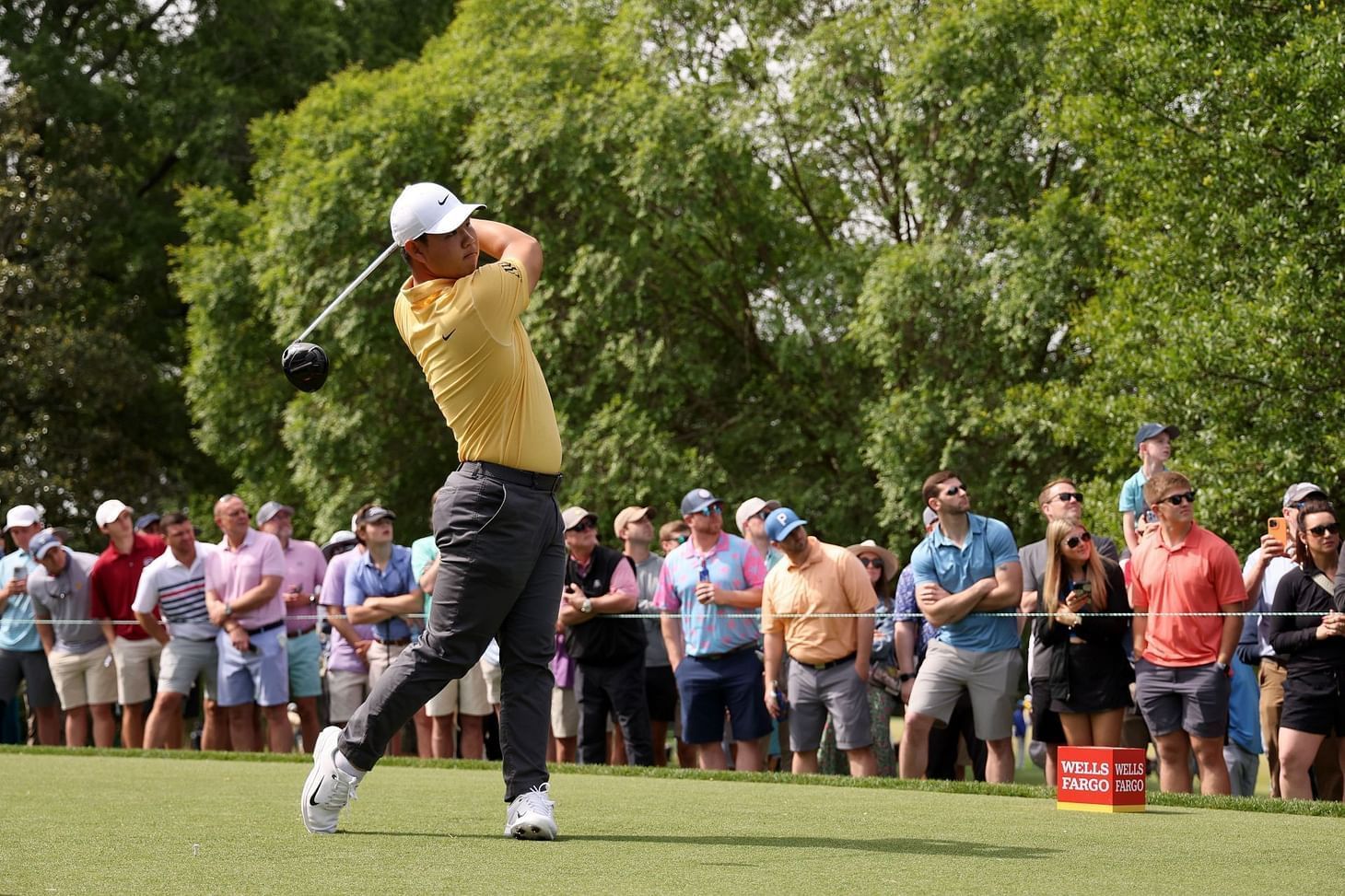 Tom Kim playing golf