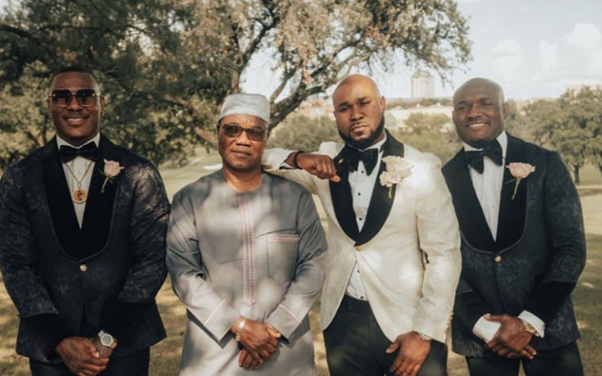 Kamaru Usman (extreme right) and his father (second from left) (Image via @usman84kg Instagram)