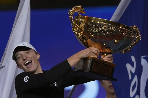 An elated Iga Swiatek with the China Open trophy