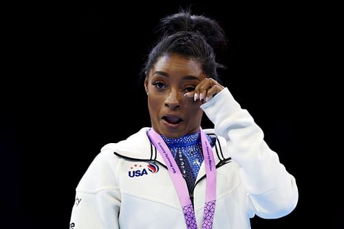 Gold medalist Simone Biles reacts during the medal ceremony for the Women's All Around Final at the 2023 Artistic Gymnastics World Championships at Antwerp Sportpaleis in Antwerp, Belgium