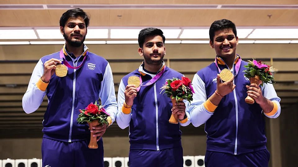 Shooters Rudrankksh Patil, Aishwary Pratap Singh Tomar and Divyansh Singh Panwar with their gold medal.