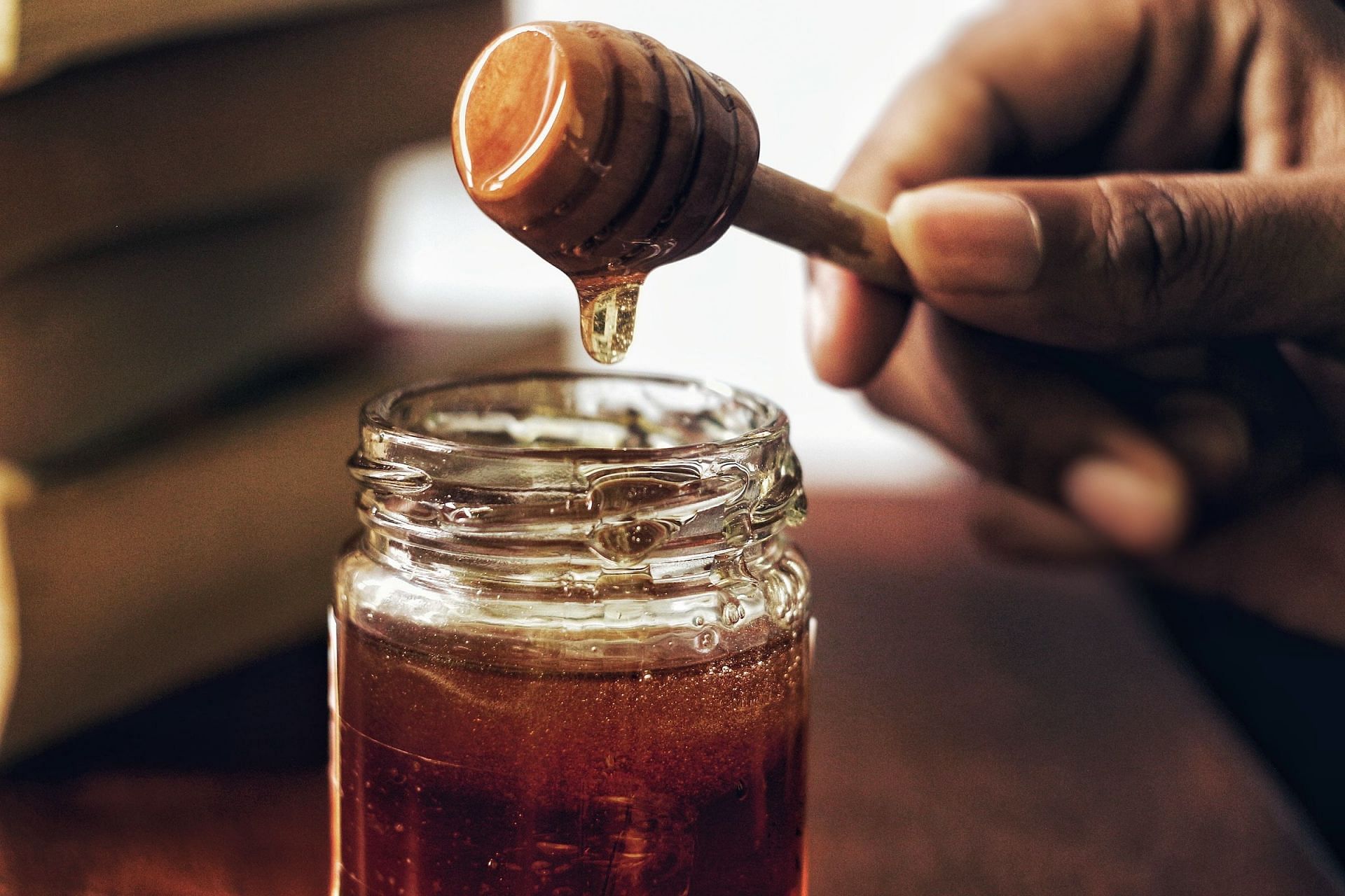 Honey is a good moisturizing agent. (Image via Unsplash/Arwin Neil Baichoo)