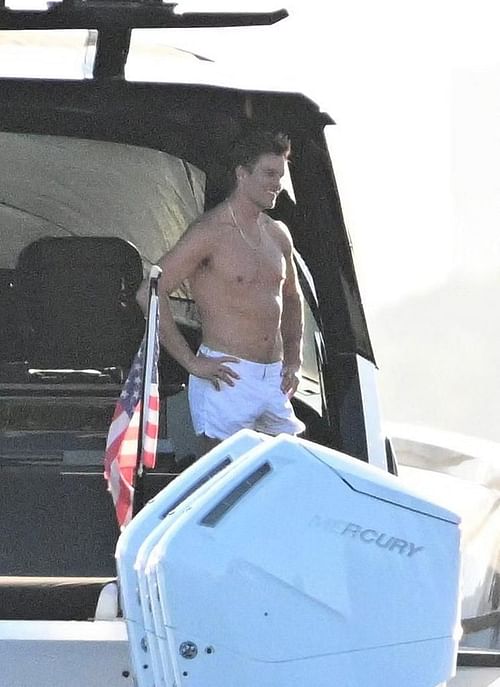 Tom Brady standing shirtless in his yacht (via Backgrid for Page Six)