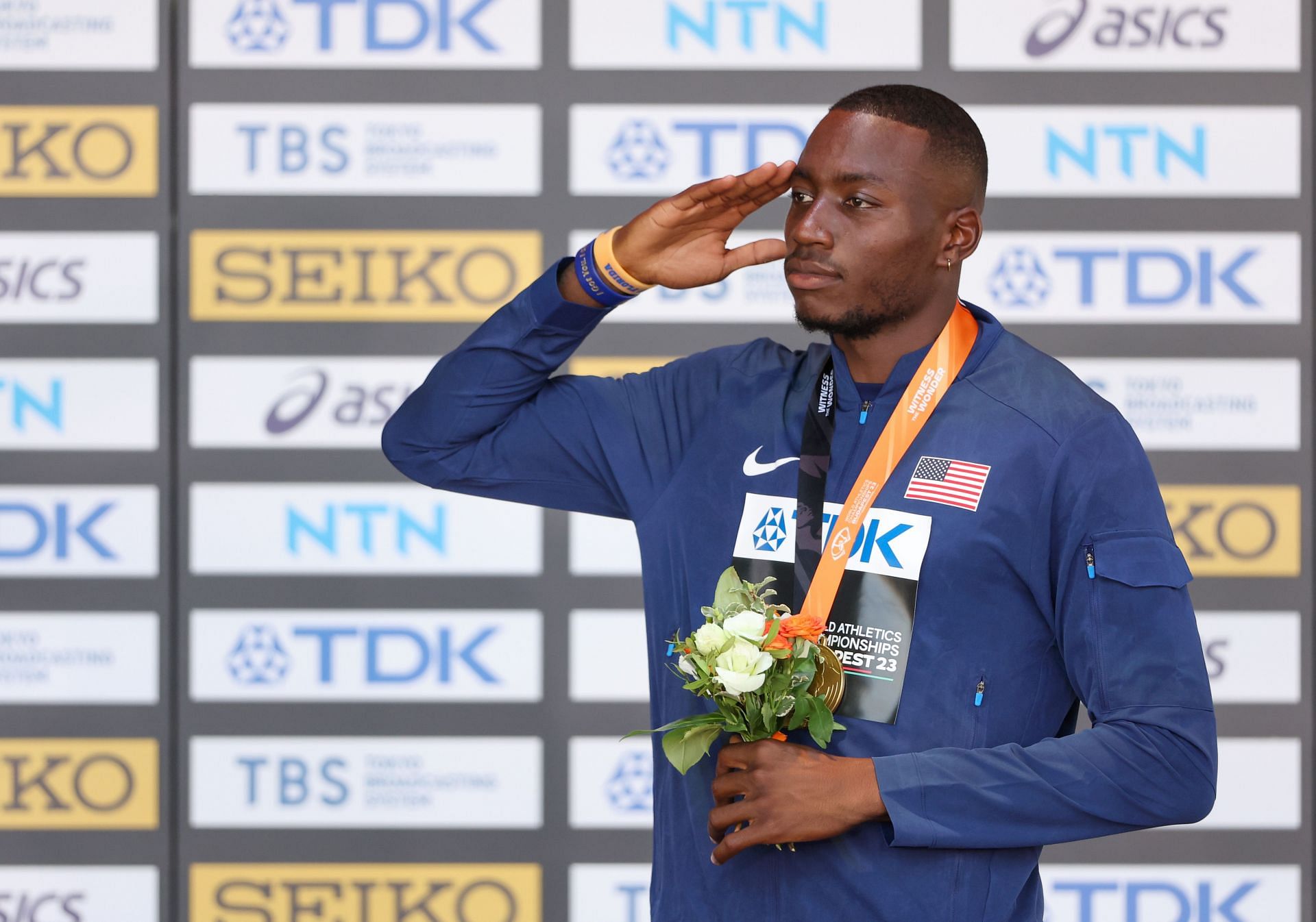 Grant Holloway celebrates with the gold medal after the Men&#039;s 110m Hurdles Final during the 2023 World Athletics Championships in Budapest, Hungary.