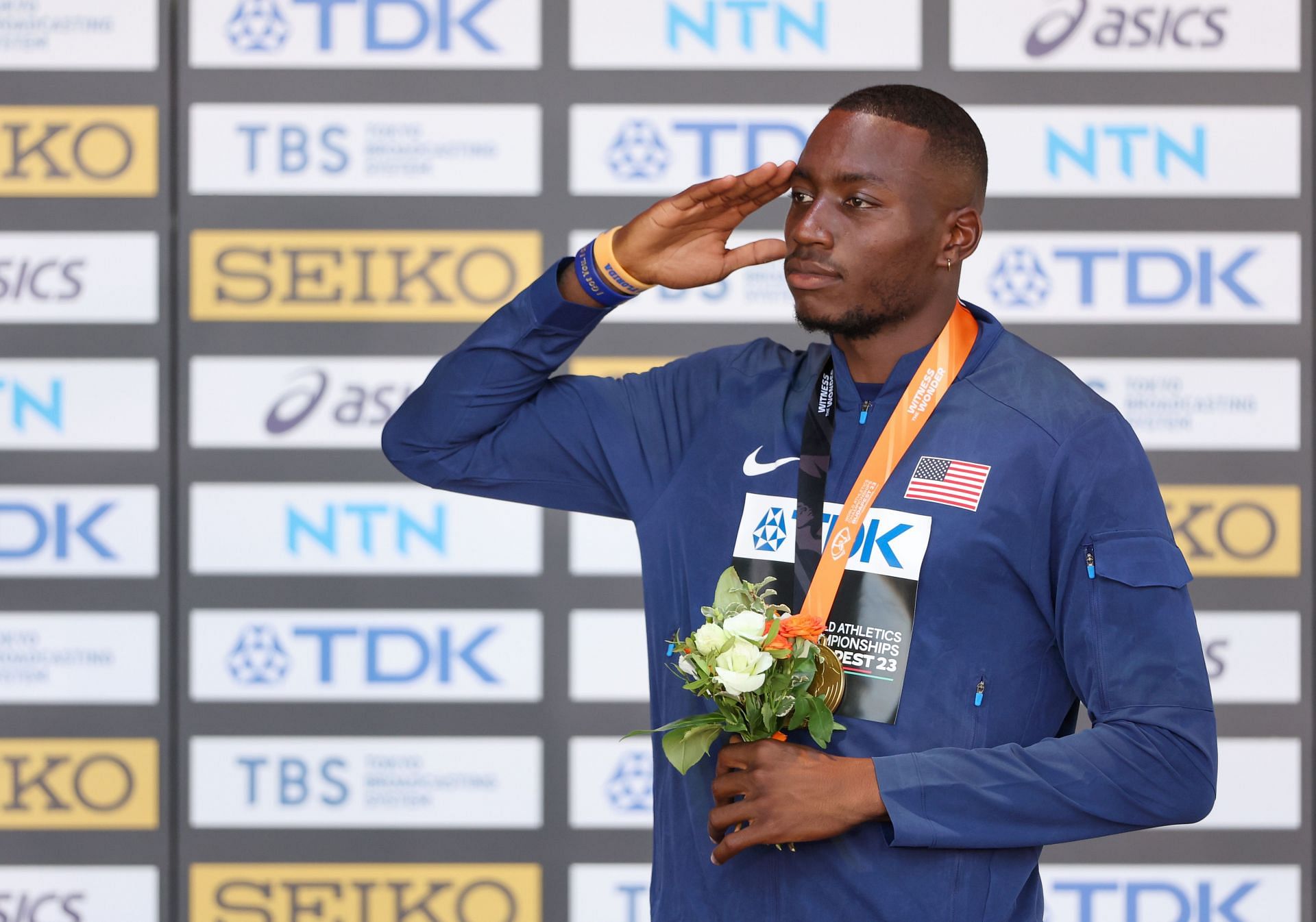 Grant Holloway celebrates with the gold medal after the Men's 110m Hurdles Final during the 2023 World Athletics Championships in Budapest, Hungary.