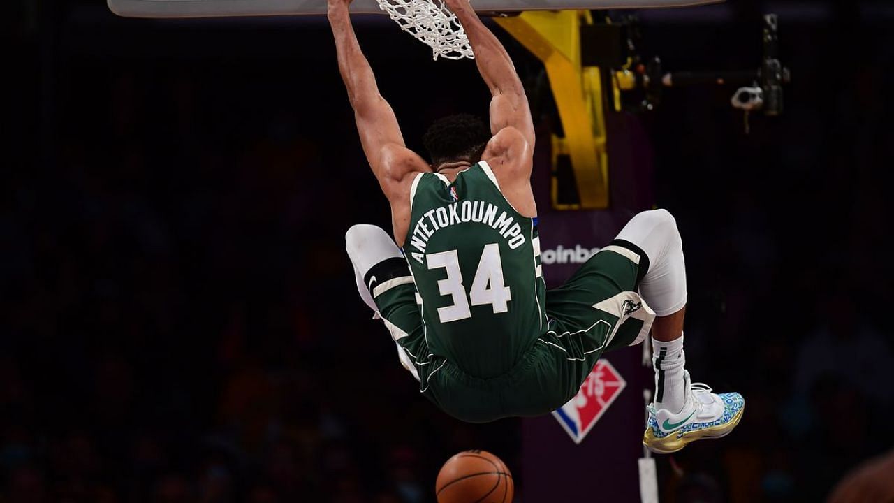 Giannis Antetokounmpo dunks the ball against the LA Lakers in his preseason debut.