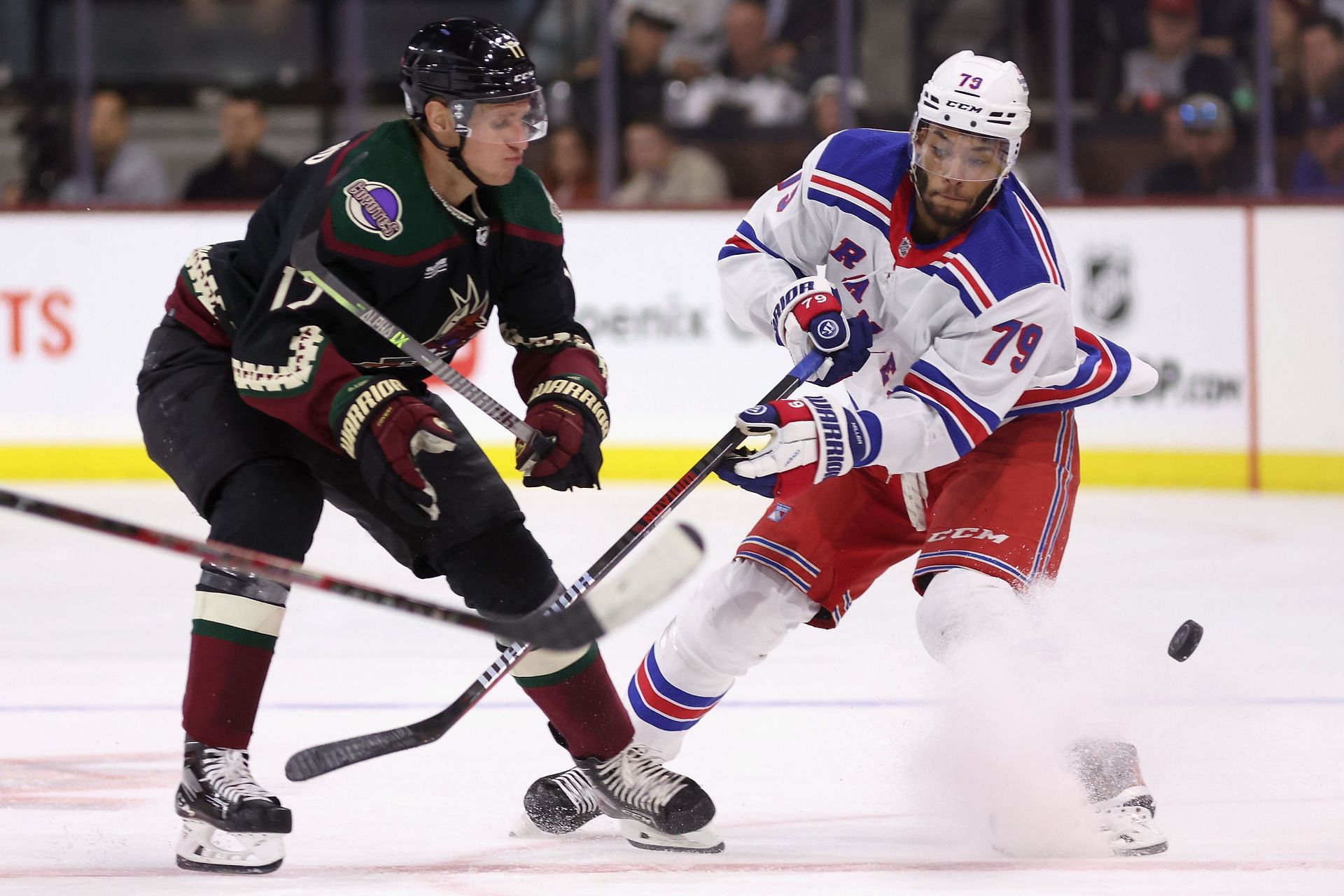 New York Rangers' Braden Schneider (45) checks New Jersey Devils