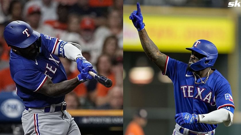 Adolis Garcia of the Texas Rangers reacts while at bat during the