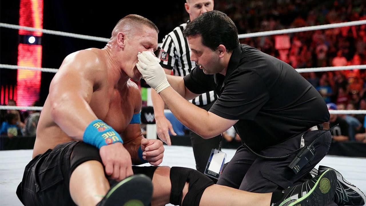 Cena receiving medical aid in the ring