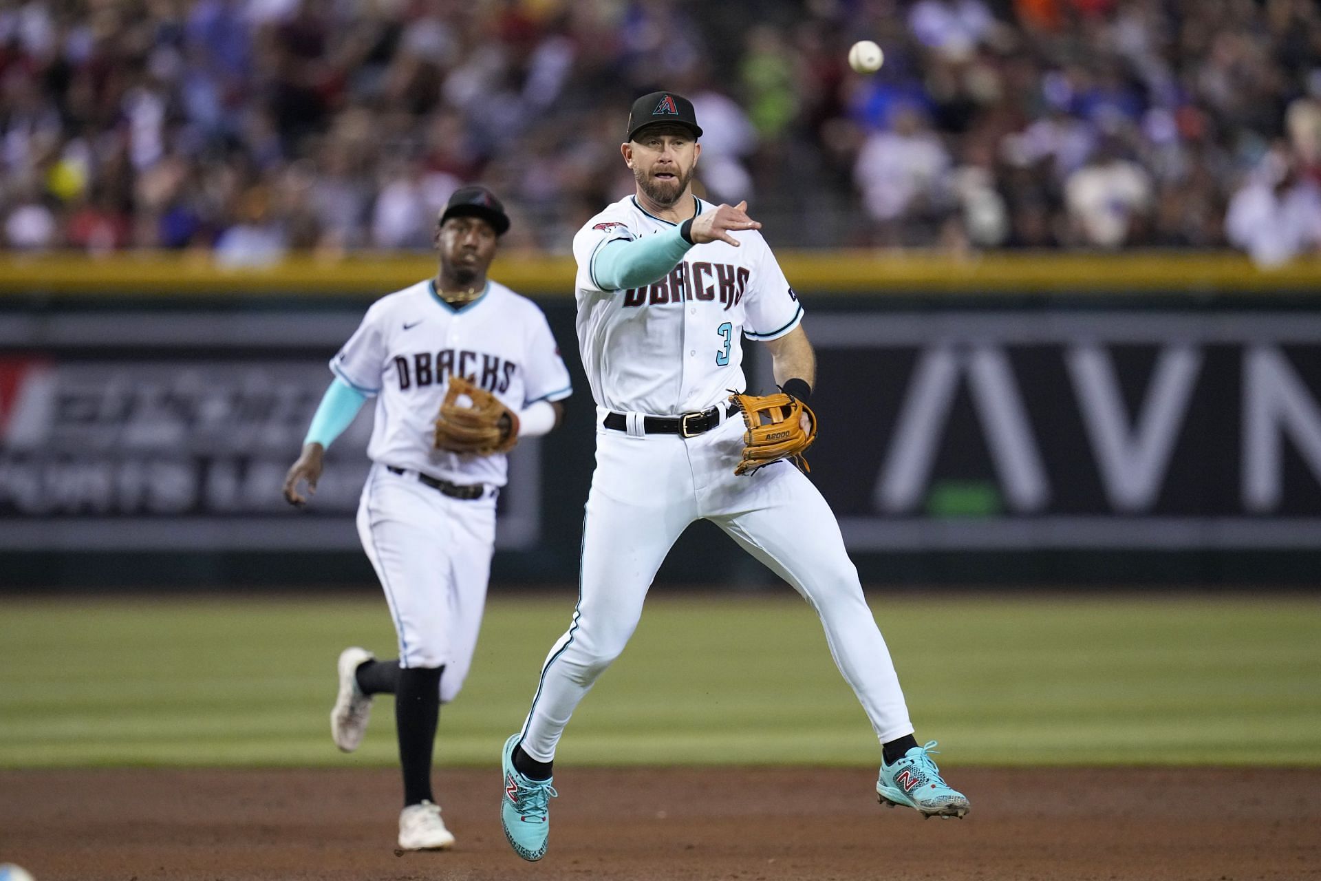 Arizona Diamondbacks third baseman Evan Longoria throws to first base againwst the Houston Astros in Phoenix