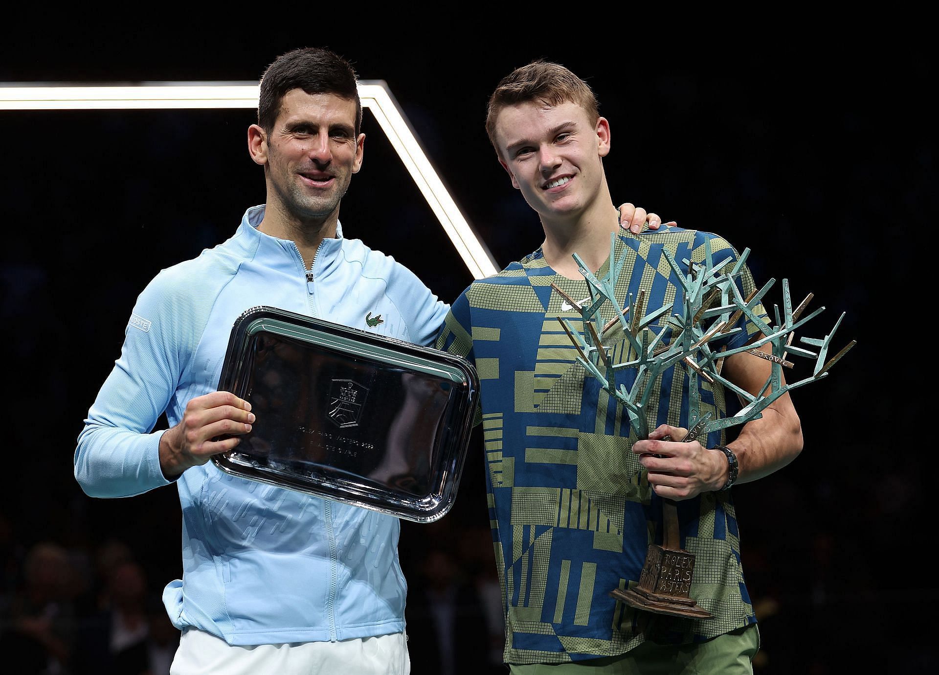 Novak Djokovic and Holger Rune after their Paris Masters singles final in 2022.