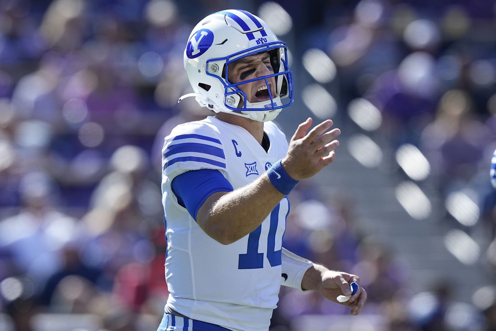 BYU quarterback Kedon Slovis (10) yells before playing from the line of scrimmage during the first half of an NCAA college football game