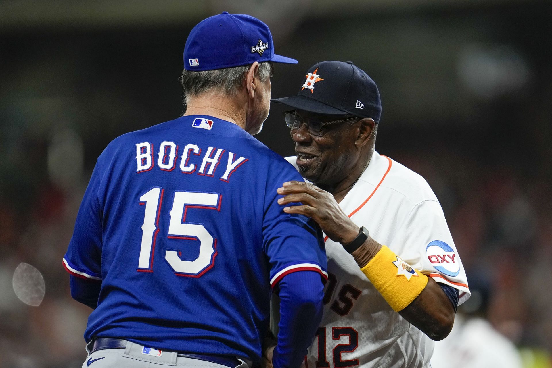 Houston manager Dusty Baker shakes hands with Texas manager Bruce Bochy before Game 1 of the AL Championship Series