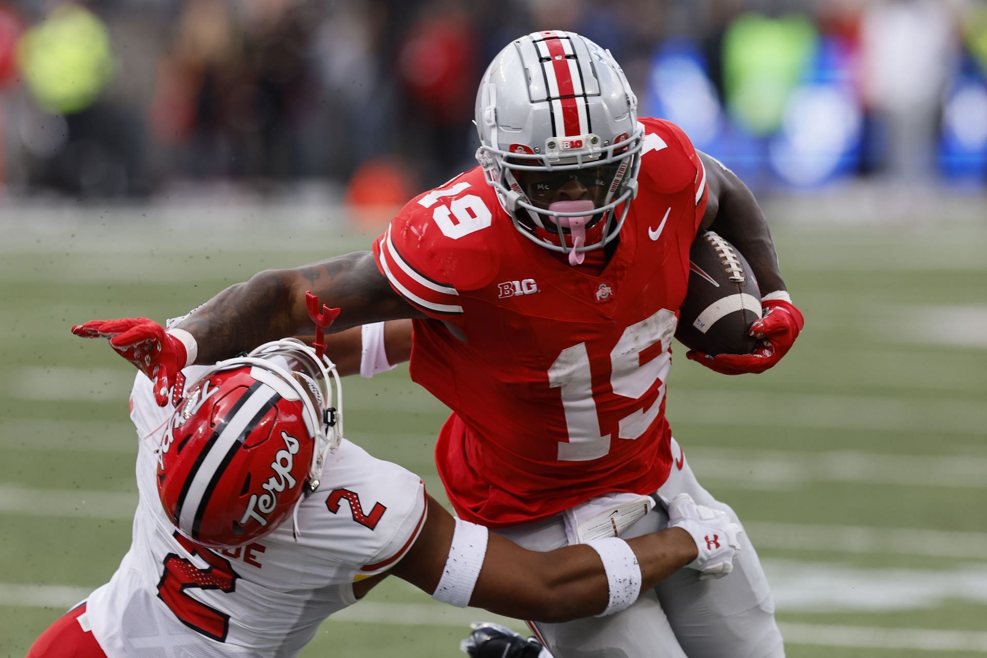 Ohio State running back Chip Trayanum, right, and Maryland defensive back Beau Brade in action during the first half of an NCAA college football game Saturday, Oct. 7, 2023, in Columbus, Ohio. (AP Photo/Jay LaPrete)