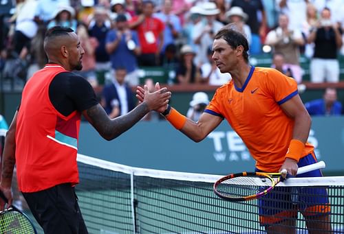 Nick Kyrgios and Rafael Nadal greet each other.